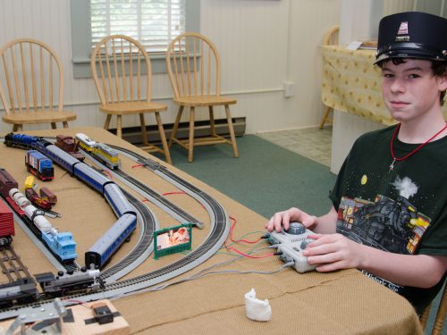 Kid playing with trains